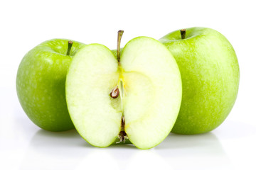 Three green apple with slice isolated on white background