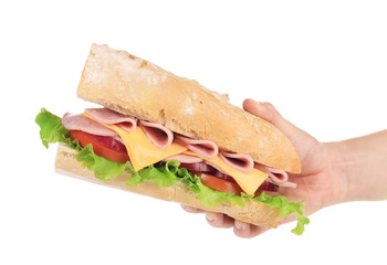 Big fresh sandwich in hands.