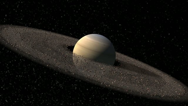 Saturn like planet with spinning asteroid rings