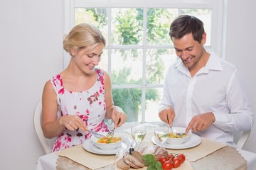Obraz na płótnie Canvas Happy young couple having food