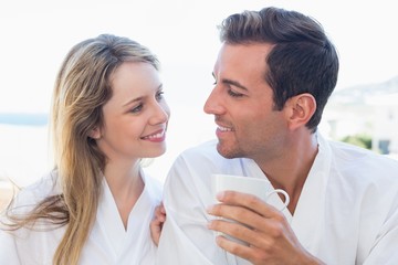 Close-up of a happy couple having coffee