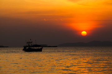 Fishing boat   in Thailand. Silhouette of Fishing Boat on Sunris