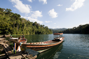 Fototapeta na wymiar Wooden boats in ratchaprapa Dam,Khao Sok,Thailand