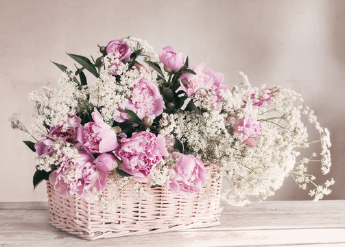 pink peony in basket