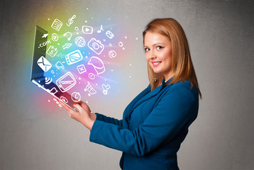 Young lady holding notebook with colorful hand drawn multimedia