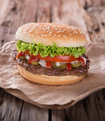 delicious hamburger on wood