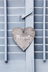 Private sign hanging outside of the window