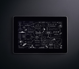 A tablet pc over the black background
