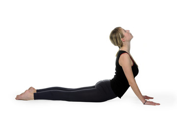 Beautiful young woman in great shape practicing yoga