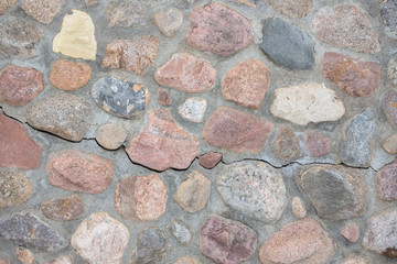Rock wall made of stones and cement.