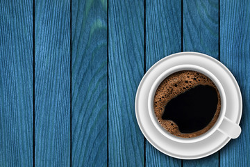 Cup of coffee on wooden background