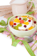 Delicious oatmeal with fruit in bowl on table close-up