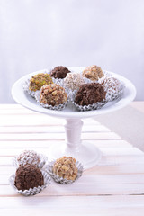 Set of chocolate candies on table on light background
