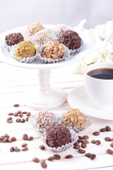 Set of chocolate candies on table on light background