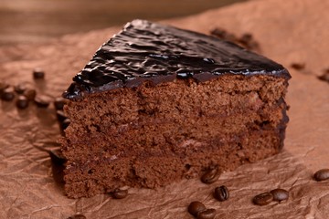 Delicious chocolate cake on table close-up
