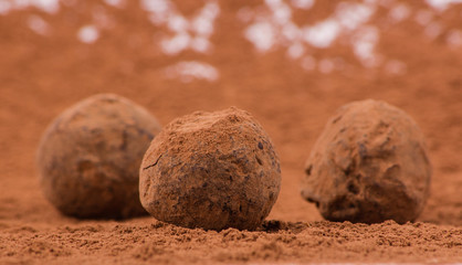 Chocolate candies on brown background