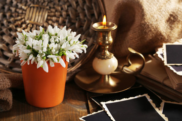 Naklejka na ściany i meble Composition with beautiful snowdrops in vase, candle, old