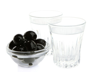 Composition with  two glasses  of vodka, and black olives,
