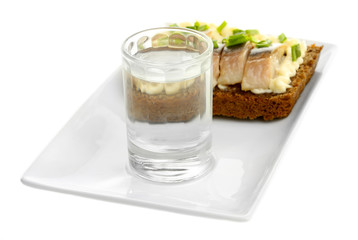 Composition with glass of vodka, and  sandwiches wit salted