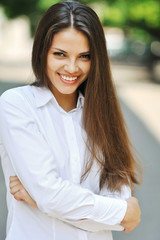 Beautiful cheerful teen girl in white shirt - outdoor