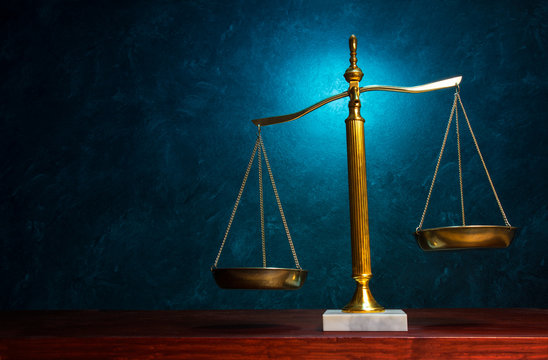 Justice scale on blue background