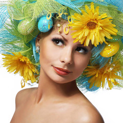 Spring Woman. Beautiful Girl with Easter Eggs and Yellow Daisy