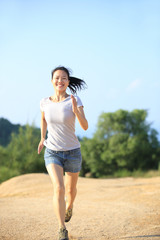  fitness woman running on desert trail    