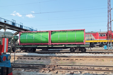 Fototapeta na wymiar Green cistern of freight train at railway station