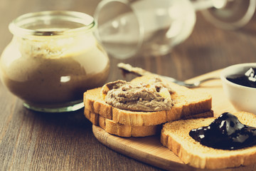Chicken liver  pate in a glass jar and toasted bread