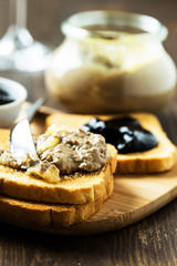Chicken liver  pate in a glass jar and toasted bread