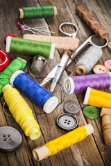 Scattered sewing spools and buttons