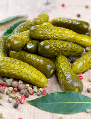 pickled cucumbers in a green bowl