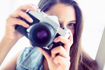 Brunette woman taking a photo