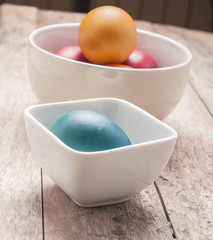 Colorful easter eggs on wooden background
