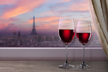 View of Paris and Eiffel tower on sunset from window with two gl
