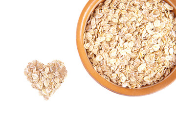 Oatmeal in a ceramic plate isolated on white background