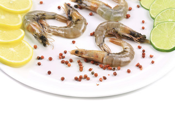 Raw shrimps on plate.