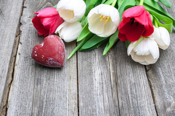 fresh tulips with a red heart