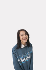 Portrait of woman wearing Christmas jumper 