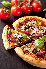 Fresh italian pizza served on black stone