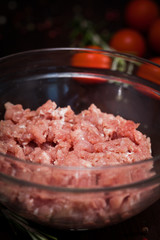 Chef making hamburgers in kitchen with ground beef 