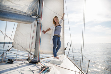 Fototapeta premium woman staying on sailboat
