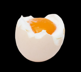 egg with yolk on black background