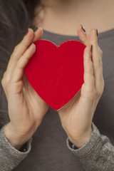 Fototapeta premium close up of girl holding a heart shaped box