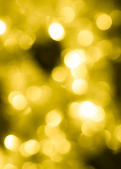 Obraz premium abstract background of yellow festive bokeh