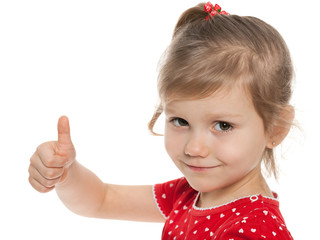 Little girl in red blouse holds her thumb up