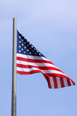 United States flag over blue sky