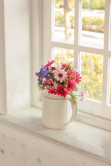 Fototapeta na wymiar flowers in vase for decorated home with sun light