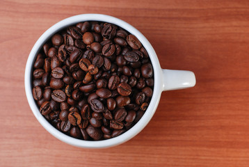Large White Cup Full Of Coffee Bean