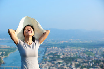 Fototapeta premium summer holiday woman enjoy the view on seaside mountain peak